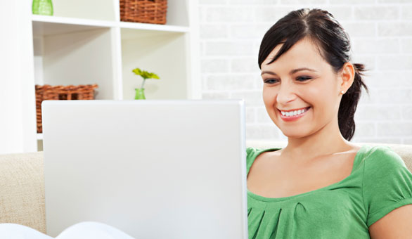 Woman on a Couch with a Laptop
