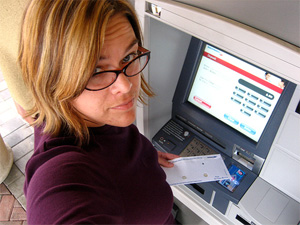 Person Cashing a Check at an ATM