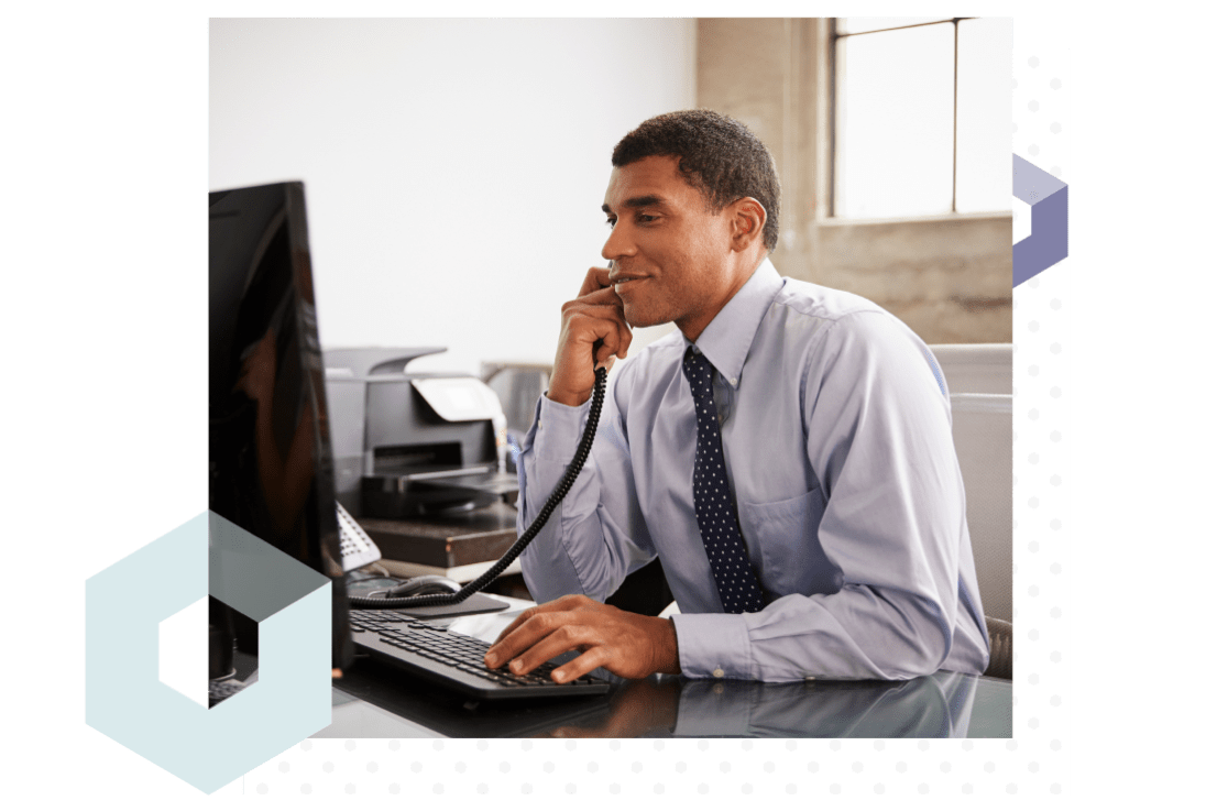 IT administrator monitoring technician access from his office computer.