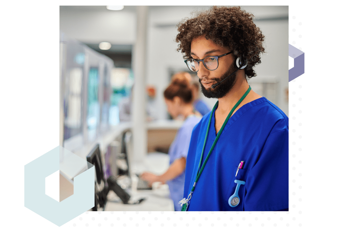 Nurse in hospital working at a computer helped by enterprise remote IT support software.