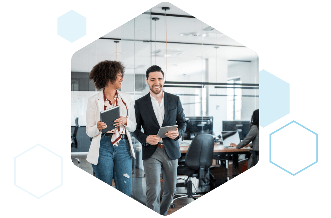 A woman and man are smiling and walking through the office, sharing positive feedback about Rescue's performance.